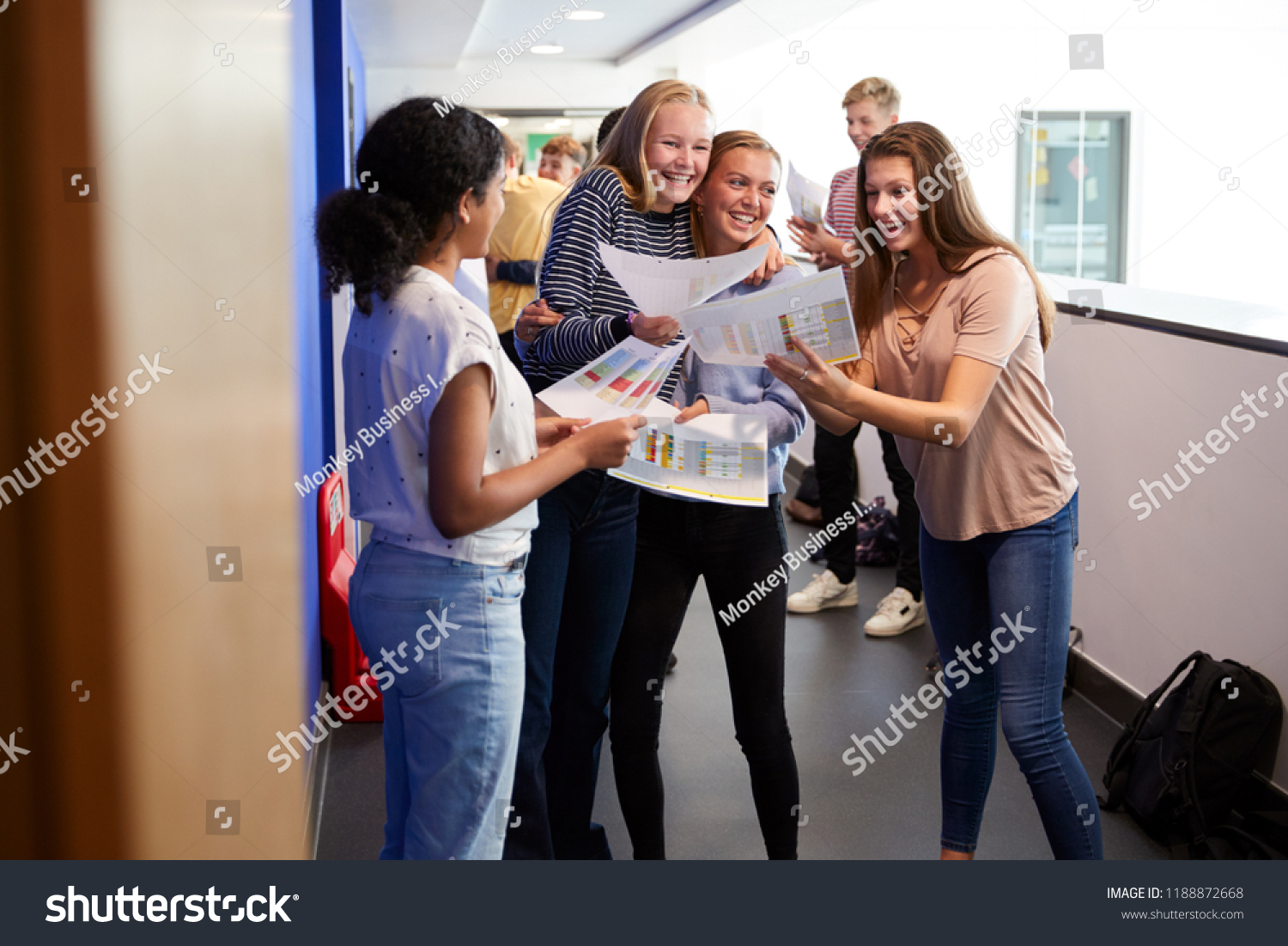 Stock Photo Excited Teenage High School Students Celebrating Exam Results In School Corridor 1188872668